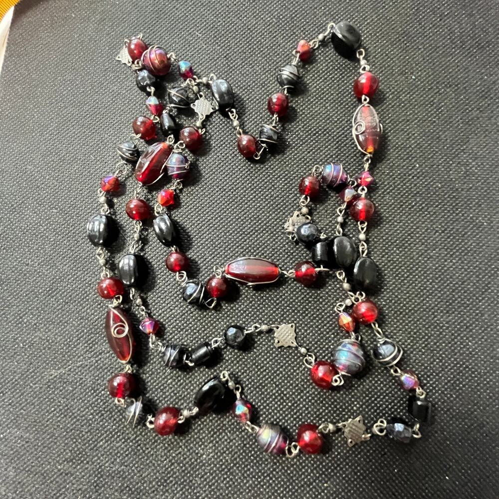 Beautiful wire wrapped beads in Black and Cranberry with iridescent beads 48"